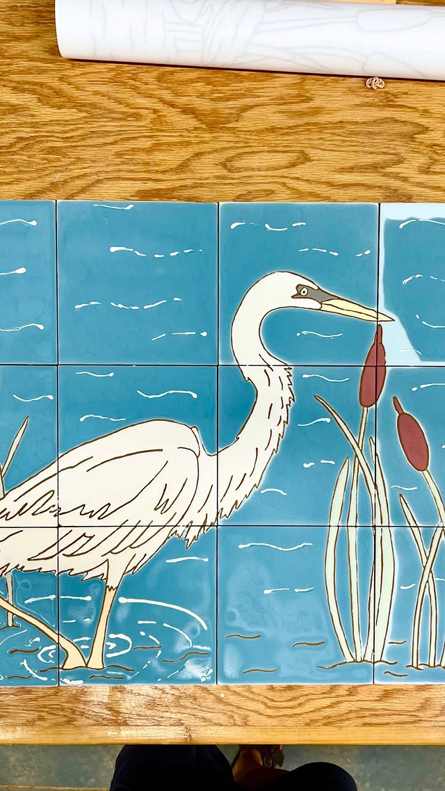 Hand-painted heron tile mural by Emily Flores