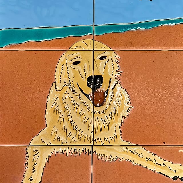 Hand-painted dog portrait tile mural by Emily Flores